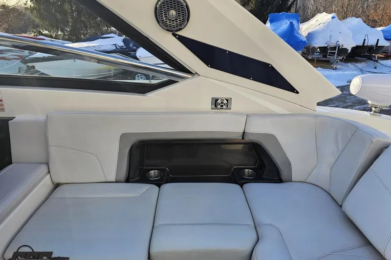 Slide: The Image of Interior seating of a 2011 Monterey 328SS Super Sport boat with cup holders. - 39