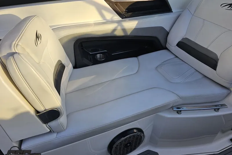 Slide: The Image of 2011 Monterey 328SS Super Sport boat interior with white leather seating and speaker. - 47