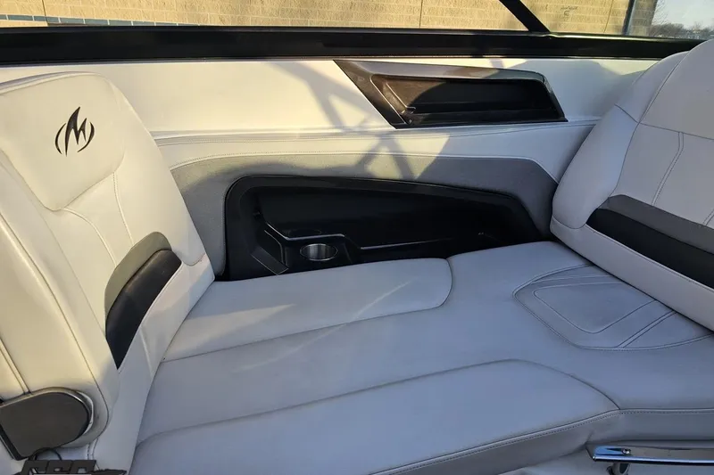 Slide: The Image of Interior of a 2011 Monterey 328SS Super Sport boat with white leather seating. - 48
