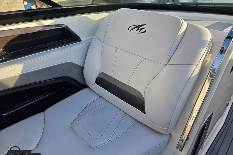 Slide: The Image of 2011 Monterey 328SS Super Sport boat seat with logo, featuring sleek white upholstery. - 50