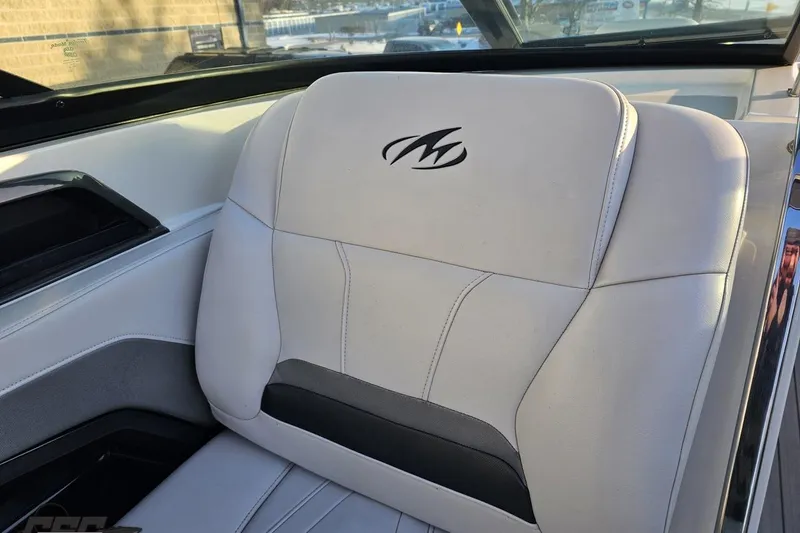 Slide: The Image of White leather seat in a 2011 Monterey 328SS Super Sport boat interior. - 51