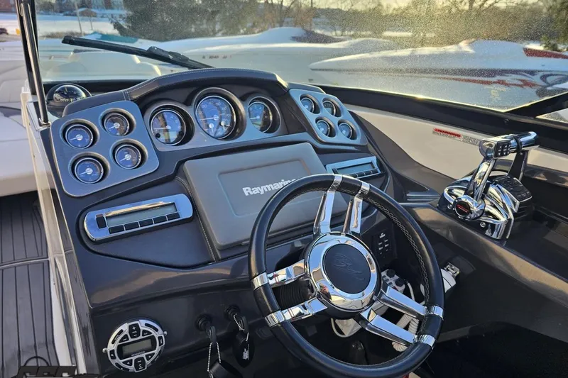 Slide: The Image of Cockpit of 2011 Monterey 328SS Super Sport boat with steering wheel and control panel. - 53