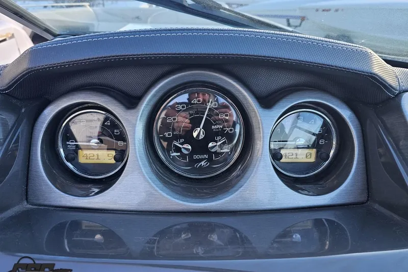 Slide: The Image of Dashboard of a 2011 Monterey 328SS Super Sport boat with speedometer and gauges. - 56