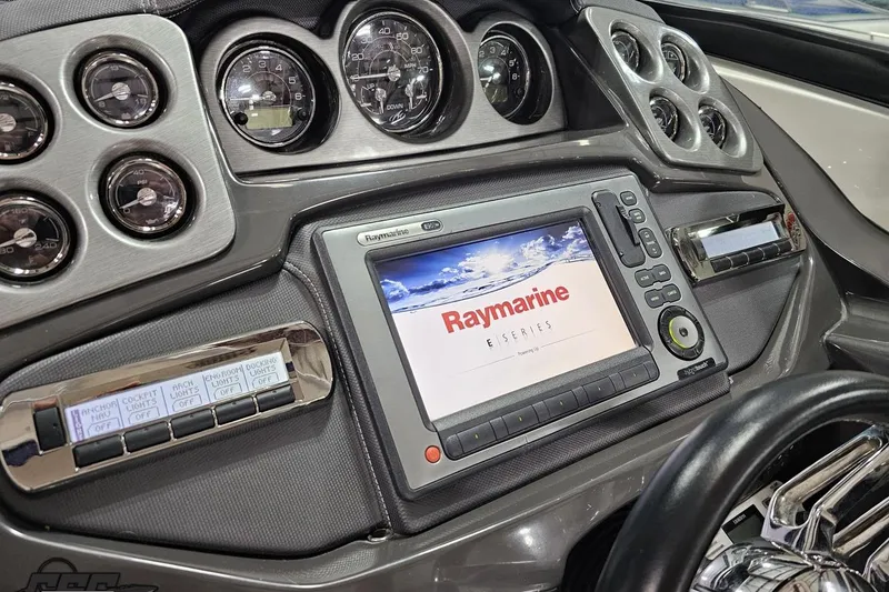 Slide: The Image of Dashboard of a 2011 Monterey 328SS Super Sport with Raymarine E-Series display. - 58
