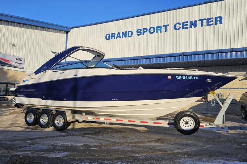 Slide: The Image of 2011 Monterey 328SS Super Sport boat on trailer at Grand Sport Center. - 6