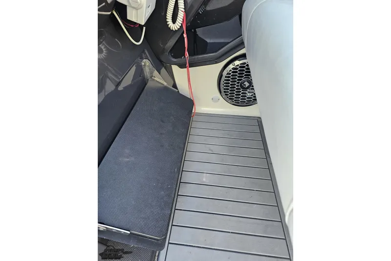 Slide: The Image of Interior of a 2011 Monterey 328SS Super Sport boat, featuring seating and speaker. - 61