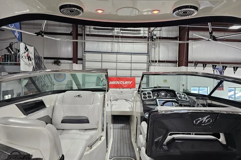Slide: The Image of Interior view of a 2011 Monterey 328SS Super Sport boat, showcasing sleek design and controls. - 62