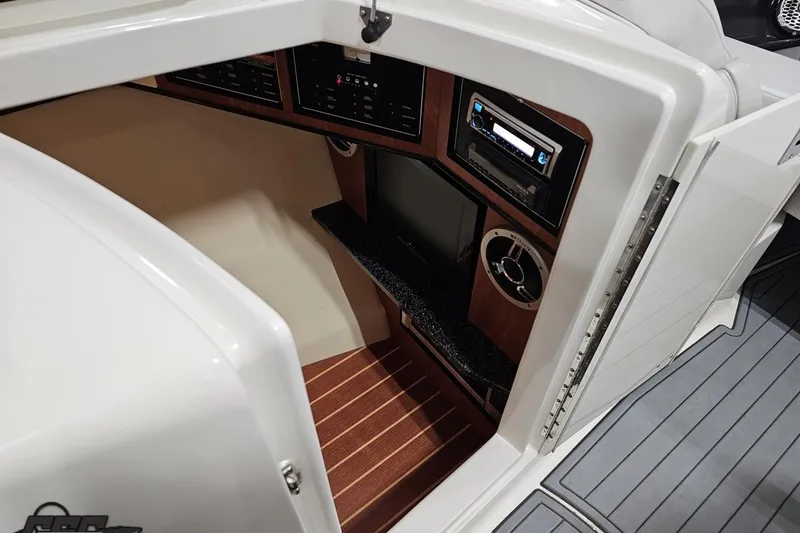 Slide: The Image of Interior view of 2011 Monterey 328SS Super Sport boat cabin with control panel. - 66
