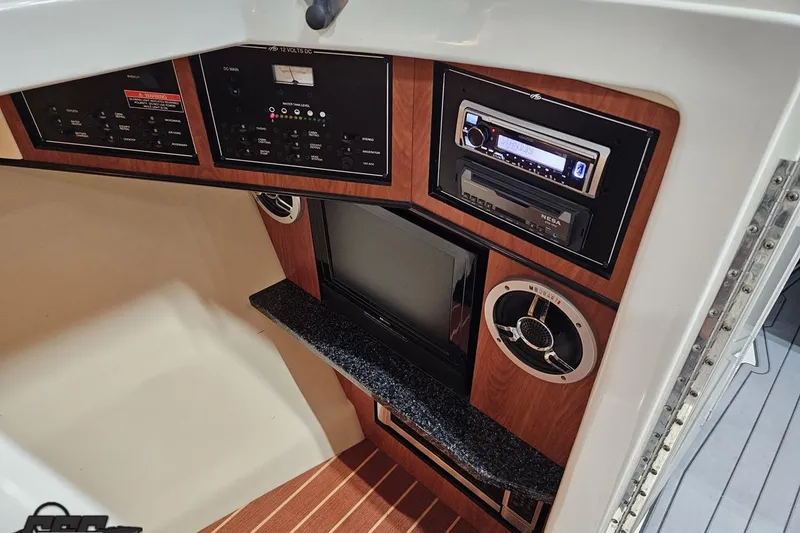 Slide: The Image of Interior of 2011 Monterey 328SS Super Sport boat with control panels and audio system. - 67