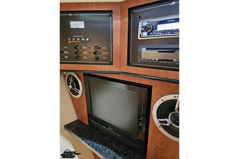 Slide: The Image of Interior of 2011 Monterey 328SS Super Sport featuring control panel, stereo, and TV. - 69