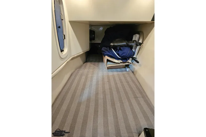 Slide: The Image of Interior cabin of a 2011 Monterey 328SS Super Sport boat, featuring storage space. - 72