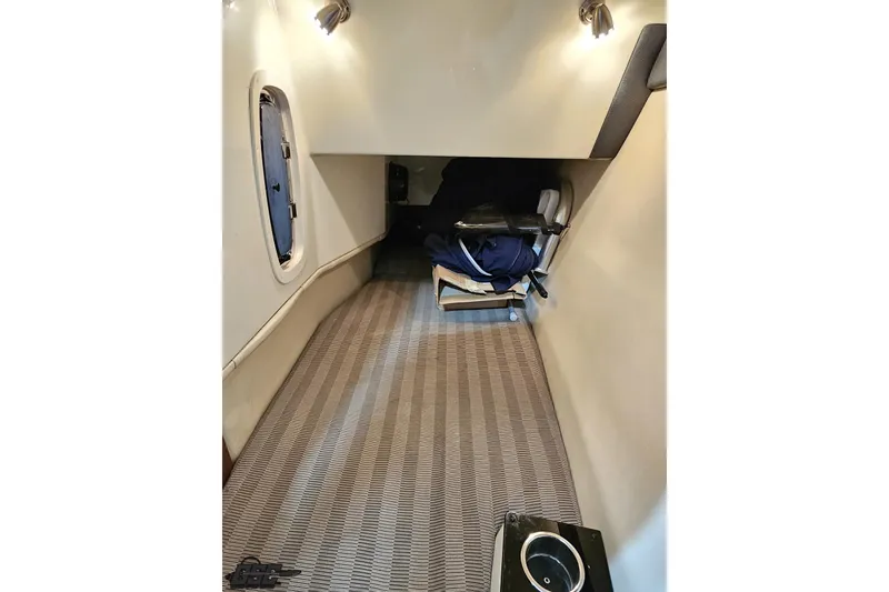 Slide: The Image of Interior cabin of 2011 Monterey 328SS Super Sport boat, featuring seating and lighting. - 73