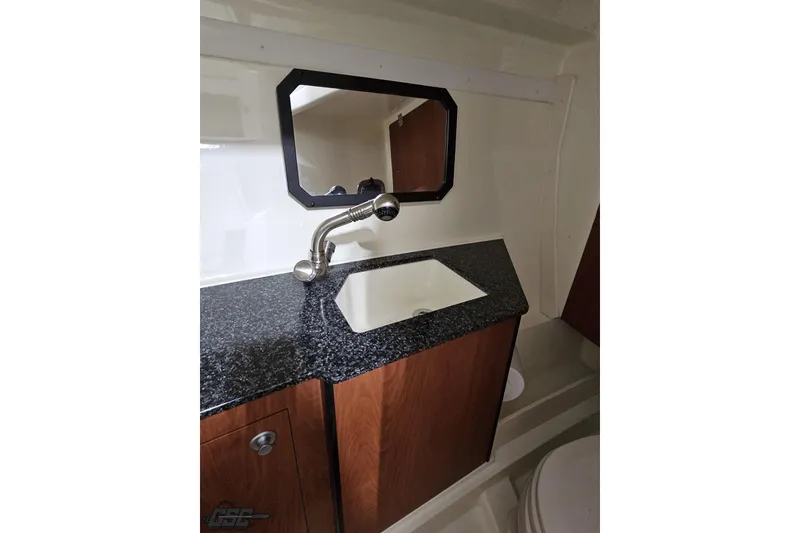 Slide: The Image of 2011 Monterey 328SS Super Sport bathroom with sink, mirror, and granite countertop. - 80