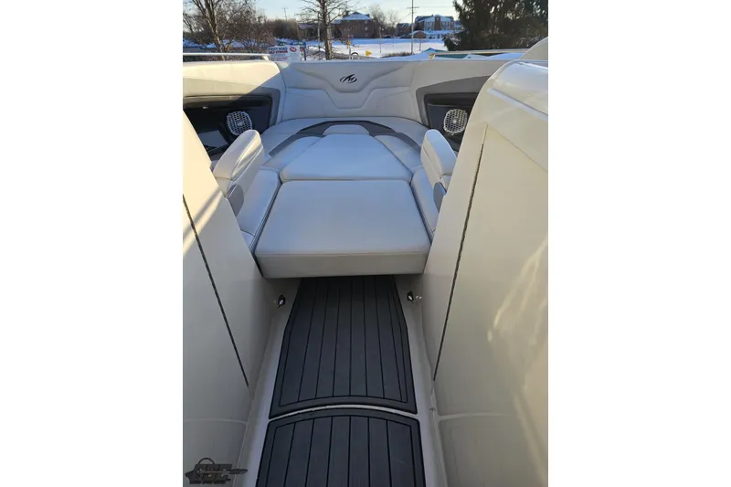 Slide: The Image of Interior view of a 2011 Monterey 328SS Super Sport boat with cushioned seating. - 87