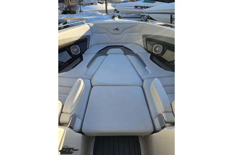 Slide: The Image of 2011 Monterey 328SS Super Sport boat interior with cushioned seating and speakers. - 88