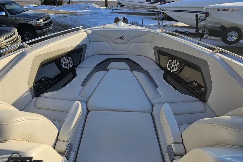 Slide: The Image of 2011 Monterey 328SS Super Sport boat interior with cushioned seating and speakers. - 89