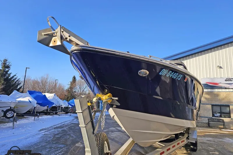 Slide: The Image of 2011 Monterey 328SS Super Sport boat on trailer, parked outdoors in winter setting. - 9