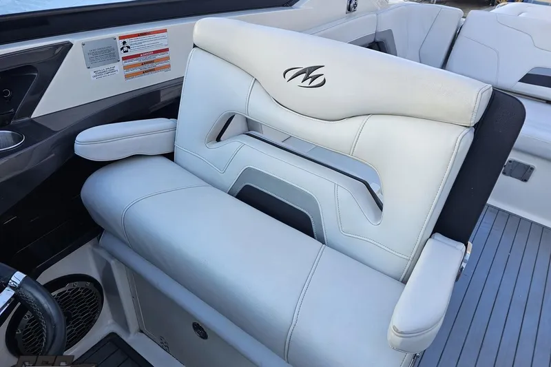 Slide: The Image of Luxury seating in a 2011 Monterey 328SS Super Sport boat, featuring sleek white upholstery. - 95