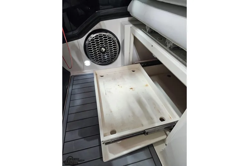 Slide: The Image of Interior of 2011 Monterey 328SS Super Sport boat with storage compartment and speaker. - 96