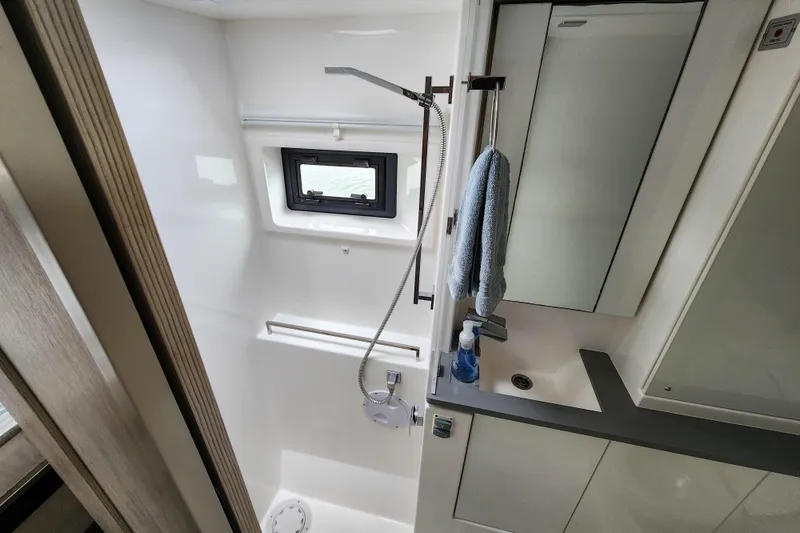Slide: The Image of Modern bathroom in a 2020 Leopard 45 yacht, featuring a shower and sink. - 105