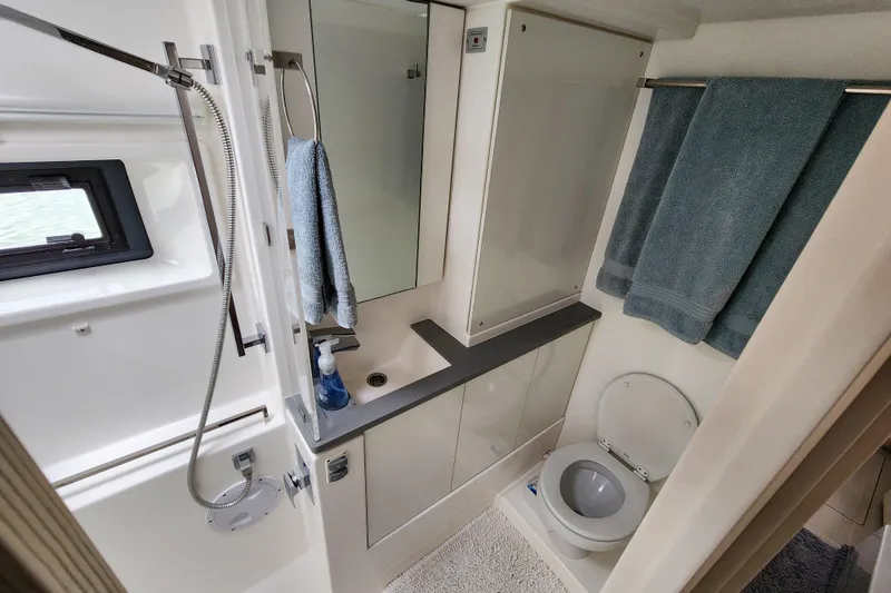 Slide: The Image of Modern bathroom in a 2020 Leopard 45 yacht, featuring shower, sink, and toilet. - 106