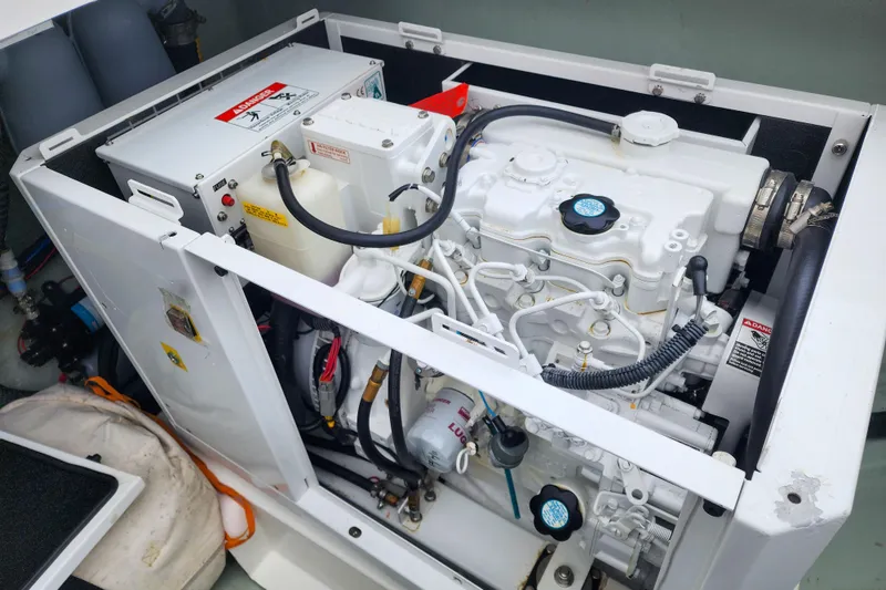 Slide: The Image of Engine compartment of a 2020 Leopard 45 yacht, showcasing mechanical components and wiring. - 107