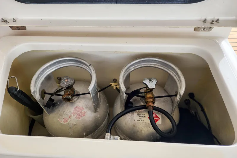 Slide: The Image of Two propane tanks in a storage compartment on a 2020 Leopard 45 yacht. - 115