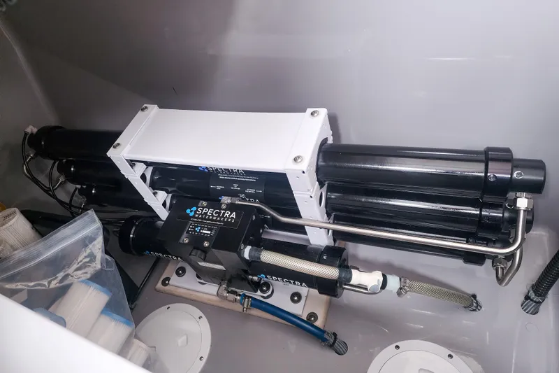 Slide: The Image of Spectra watermaker system in a 2020 Leopard 45 yacht, featuring advanced filtration components. - 117