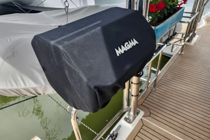 Slide: The Image of Protective cover on Leopard 45 yacht deck, featuring "MAGMA" branding, 2020 model. - 14