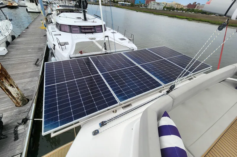 Slide: The Image of Solar panels on a 2020 Leopard 45 catamaran docked at a marina. - 20