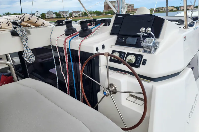 Slide: The Image of Helm of 2020 Leopard 45 catamaran with navigation equipment and steering wheel. - 28