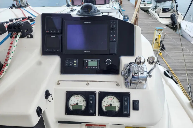 Slide: The Image of Control panel of a 2020 Leopard 45 yacht with navigation and throttle controls. - 29