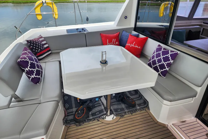 Slide: The Image of Cozy seating area on a 2020 Leopard 45 yacht with decorative pillows and table. - 3