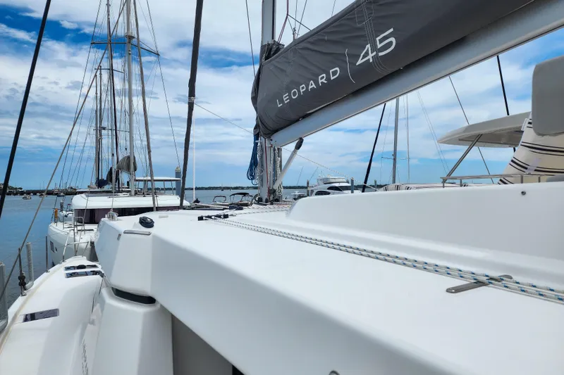 Slide: The Image of 2020 Leopard 45 catamaran docked, showcasing sleek design and modern features. - 35