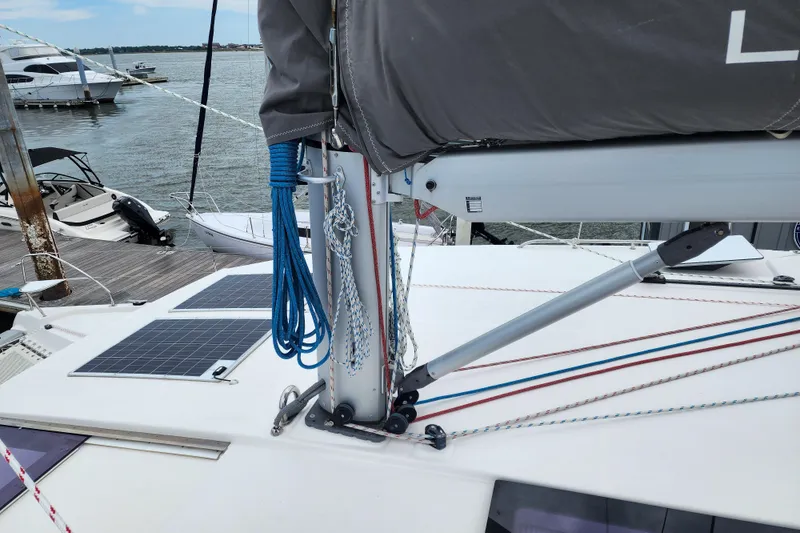 Slide: The Image of Sailboat deck with solar panels and rigging, Leopard 45 model, docked at marina. - 37