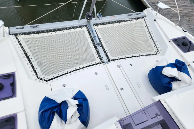 Slide: The Image of Catamaran deck with netting and blue cushions, Leopard 45 model, 2020. - 47