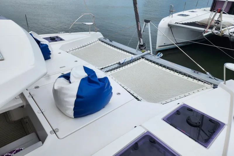 Slide: The Image of 2020 Leopard 45 catamaran deck with blue and white bean bag chairs. - 50