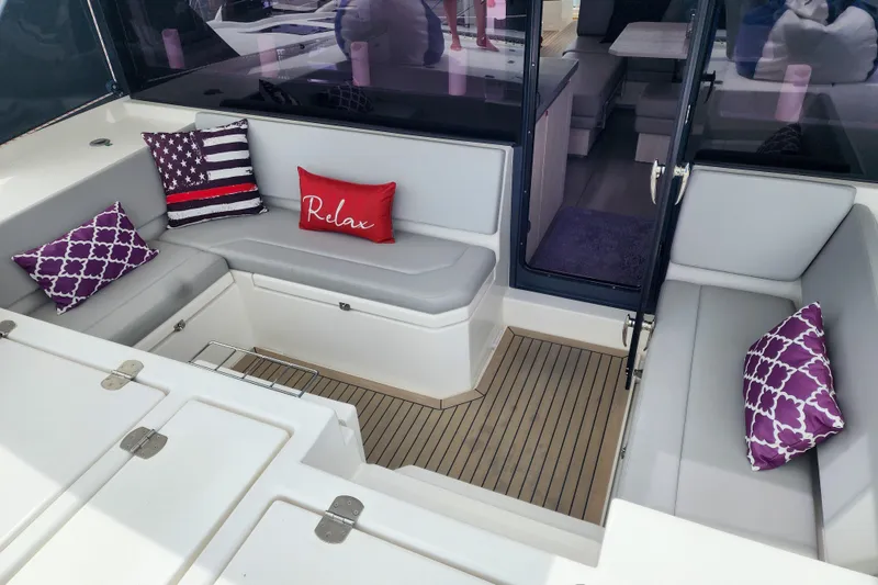 Slide: The Image of Luxurious 2020 Leopard 45 yacht interior with comfortable seating and decorative pillows. - 52