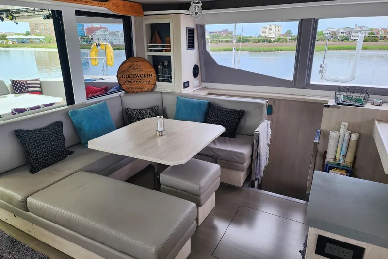 Slide: The Image of Luxurious interior of a 2020 Leopard 45 catamaran with comfortable seating and scenic water views. - 59