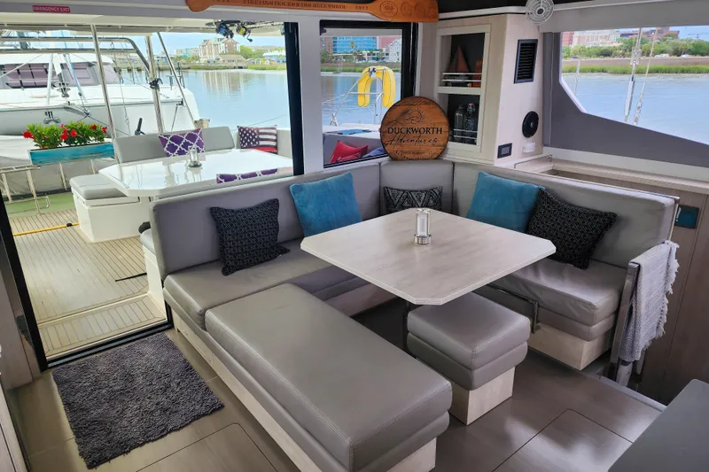 Slide: The Image of Luxurious interior of a 2020 Leopard 45 catamaran with elegant seating and waterfront view. - 60