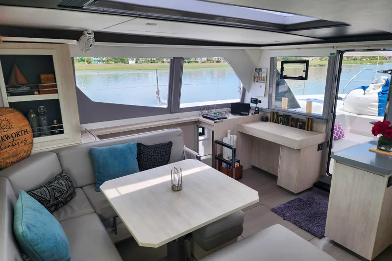 Slide: The Image of Luxurious interior of a 2020 Leopard 45 catamaran with modern furnishings and scenic water views. - 63