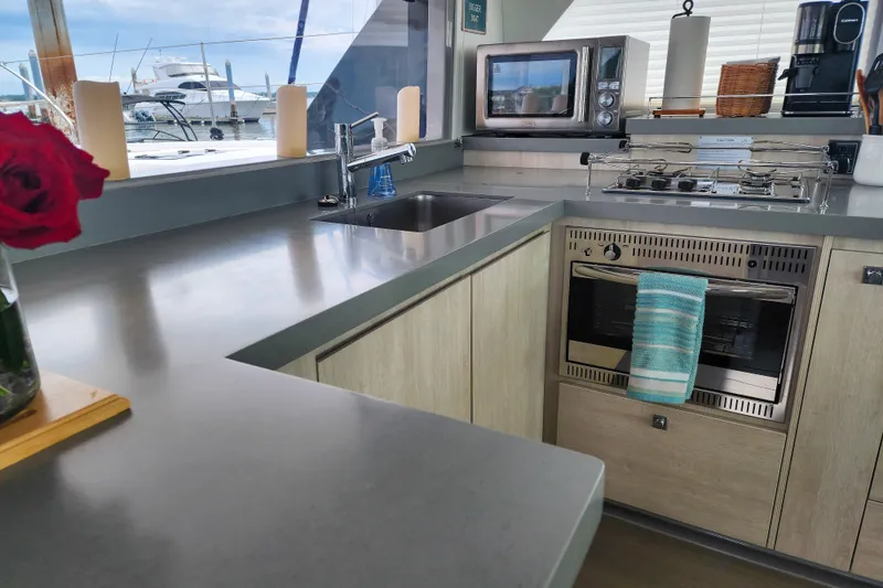 Slide: The Image of Modern kitchen interior on a 2020 Leopard 45 yacht, featuring appliances and sleek countertops. - 68