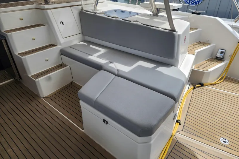 Slide: The Image of Luxury seating area on 2020 Leopard 45 yacht with teak flooring. - 7