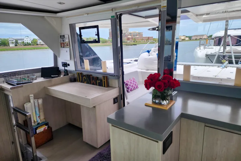 Slide: The Image of Interior of a 2020 Leopard 45 catamaran with modern decor and waterfront view. - 71