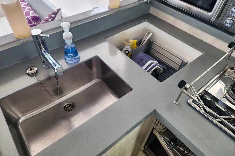Slide: The Image of Modern kitchen sink and stove area on a 2020 Leopard 45 yacht. - 72