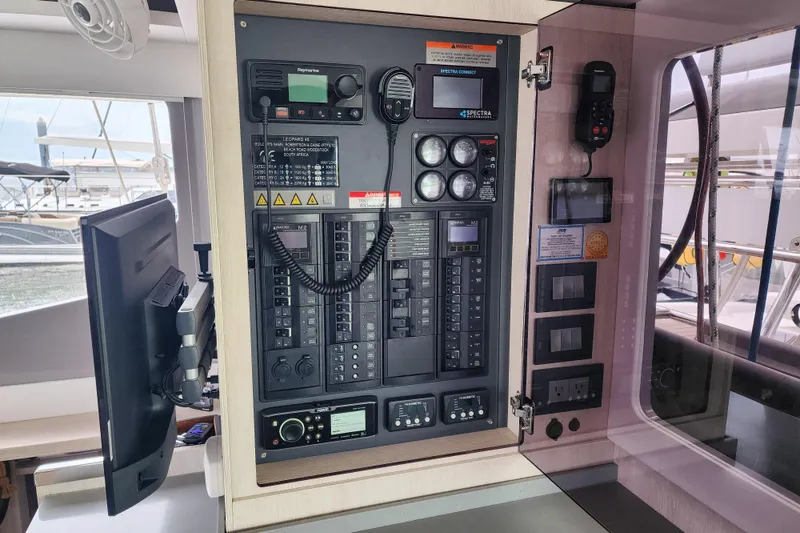 Slide: The Image of Control panel of a 2020 Leopard 45 catamaran, featuring navigation and communication equipment. - 76