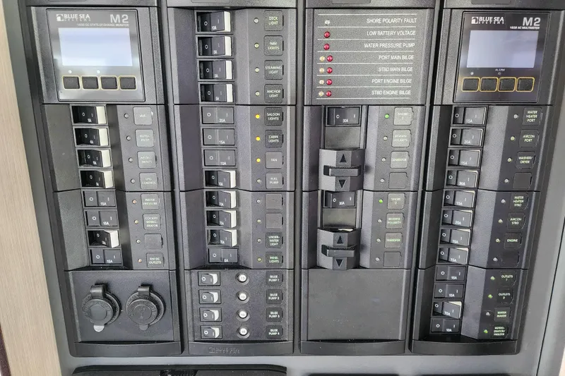 Slide: The Image of Electrical control panel on a 2020 Leopard 45 yacht, featuring Blue Sea Systems components. - 77