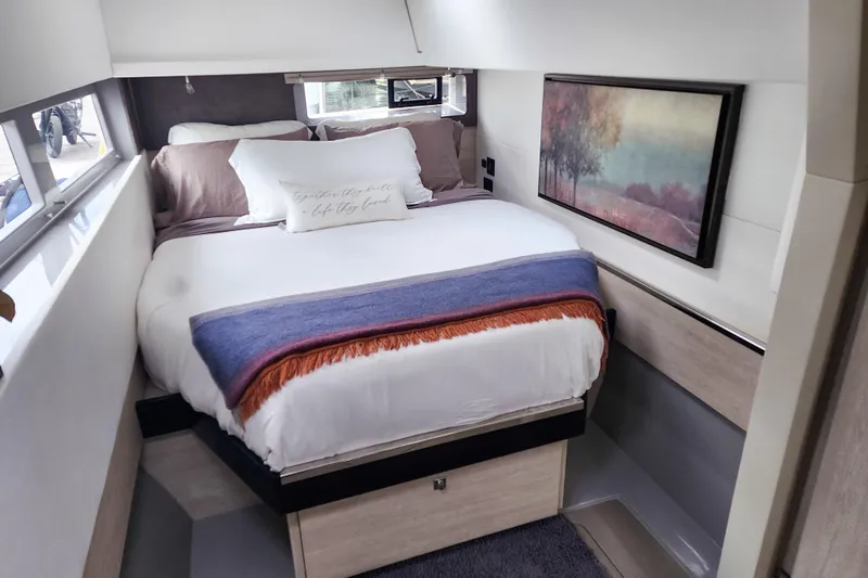 Slide: The Image of Luxurious bedroom interior of 2020 Leopard 45 yacht with cozy bed and scenic artwork. - 84