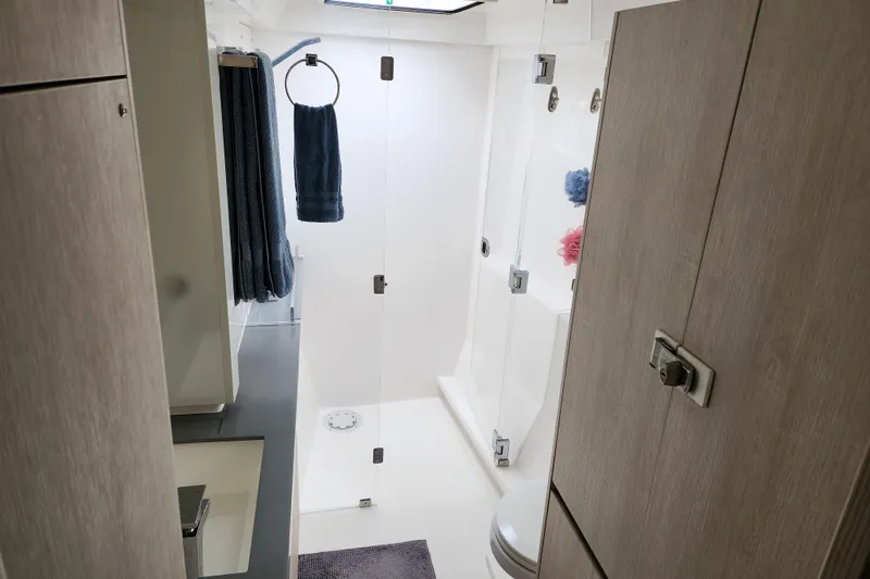 Slide: The Image of Modern bathroom interior in a 2020 Leopard 45 yacht, featuring sleek design and glass shower. - 88
