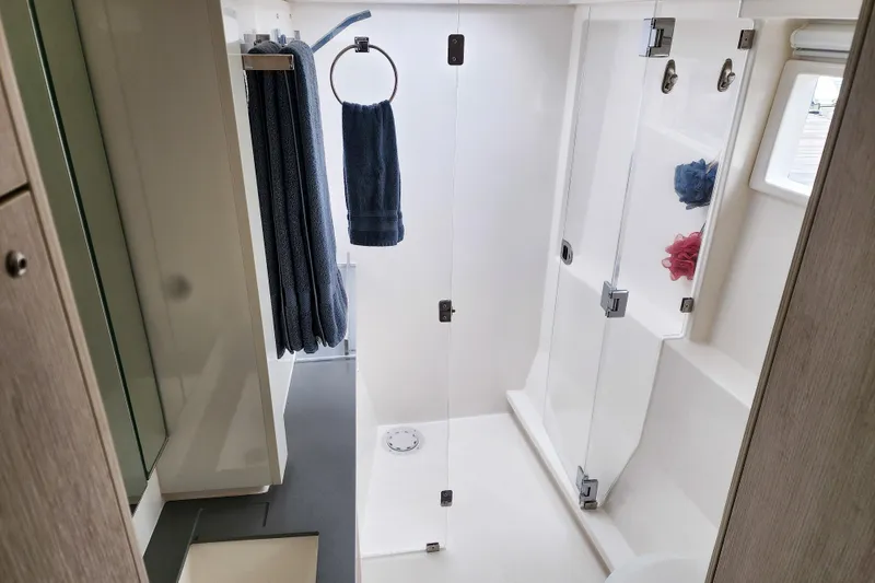 Slide: The Image of Modern bathroom in 2020 Leopard 45 yacht with glass shower and towels. - 89